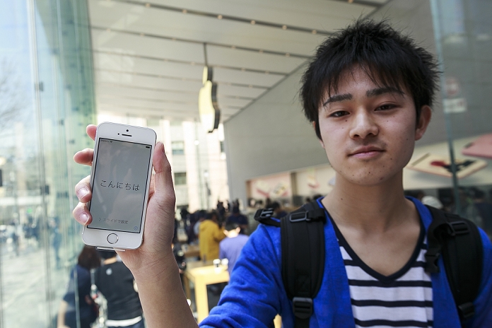 Apple  iPhone SE  Launched Smaller and less expensive than before The first customer Daiki Shimizu  18  shows his new iPhone SE outside the Apple Store in Omotesando on March 31, 2016 in Tokyo, Japan. A new iPhone SE model and a new iPad Pro 9 inch model go on sale for the first time. The two smaller models are priced below the current iPhone and iPad Pro and Apple hopes that they will appeal to new users and also those preferring smaller gadgets, and that they will help to boost sales in a usually slower spring period.  Photo by Rodrigo Reyes Marin AFLO 