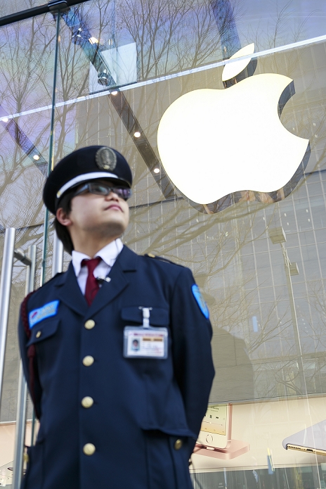 Apple  iPhone SE  Launched Smaller and less expensive than before A security guard patrols the entrance of the Apple Store before opens its doors for the launching of Apple s new iPhone SE and iPad Pro in Omotesando on March 31, 2016 in Tokyo, Japan. A new iPhone SE model and a new iPad Pro 9 inch model go on sale for the first time. The two smaller models are priced below the current iPhone and iPad Pro and Apple hopes that they will appeal to new users and also those preferring smaller gadgets, and that they will help to boost sales in a usually slower spring period.  Photo by Rodrigo Reyes Marin AFLO 