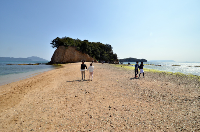 Shodoshima  Angel Road A popular tourist spot March 20, 2016, Kagawa, Japan   People walk on the Angel Road which connects small island from Shodoshima island with a narrow sandbar at tide water twice in the day at Shodoshima island in Kagawa prefecture on Sunday, March 20, 2016. It is said couples walk on the sandy road toward the small island, they will make happy together.   Photo by Yoshio Tsunoda AFLO  LWX  ytd 
