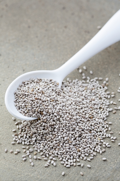 White Chia seeds. Pile of seeds from the chia (Salvia hispanica) plant. Chia is grown commercially for its edible seeds, which are rich in omega-3 fatty acids and are traditionally eaten in Mexico, and the southwestern United States.
