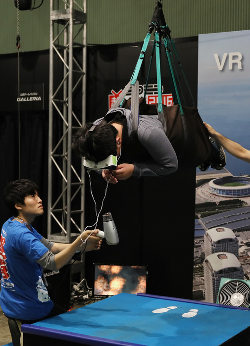 Nico Nico Cho Kaigi 2016 Politics, Cosplay, Anything Goes  April 30, 2016, Chiba, Japan   A visitor, hanged in the air by wire, enjoys virtual sky diving with headmount during the Niconico Chokaigi in Chiba on Saturday, April 30, 2016. Some 150,000 visitors enjoyed over 100 booths including games, hobbies, sports, politics as well as Japan s sub cultures at the two day offline meeting sponsored by Japan s video sharing website  Niconico Douga .   Photo by Yoshio Tsunoda AFLO  LWX  ytd 