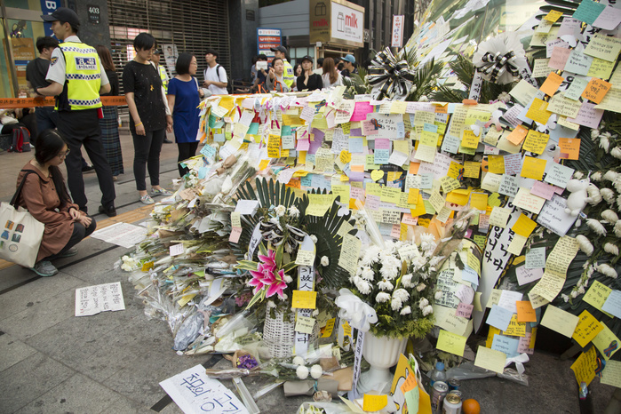 23 Year Old Woman Murdered in South Korea Protests Grow Mourning the stabbing death of a woman, May 22, 2016 : People leave notes at an entrance of Gangnam subway station in Seoul, South Korea, to mourn the stabbing death of a 23 year old woman by a male attacker. A 34 year old man who has a record of schizophrenia, was arrested on May 17, 2016 on suspicion of killing the 23 year old woman at a bar bathroom near the Gangnam subway station in Gangnam district, which has sparked a wave of mourning and a public outcry over violence against women in the traditionally male dominated country. The two had never met prior to the incident, the police said.  Photo by Lee Jae Won AFLO   SOUTH KOREA 