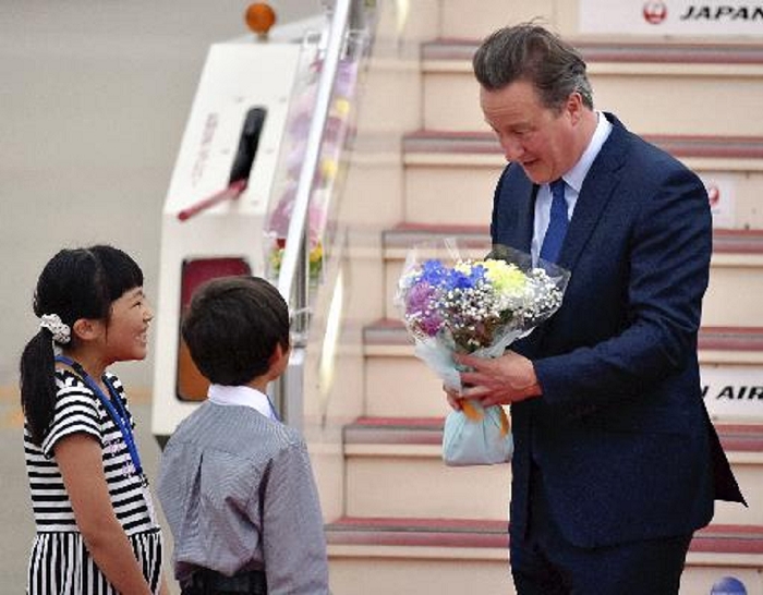 G7 Ise Shima Summit British Prime Minister to arrive in Japan British Prime Minister David Cameron receives a bouquet of flowers from Anne Kamiya  left  and Tomotaka Usui upon his arrival at Central Japan International Airport for the Iseshima Summit  6:03 p.m., May 25, in Tokoname City, Aichi Prefecture Photo by Shintaro Nakane