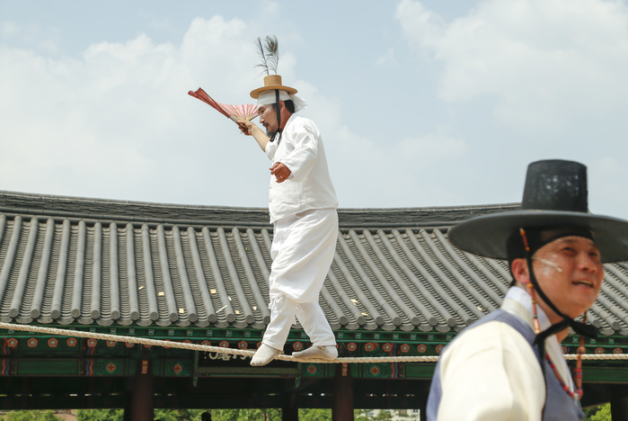 Important Intangible Cultural Asset  Tightrope Walking Performed at a festival in Seoul, Korea Dano Festival, June 9, 2016 : Kim Dae gyun  C , tightrope walking master and the Important Intangible Cultural Property No. 58 of South Korea, performs during  Early Summer High Day, Dano Festival  at the Namsangol Hanok Village in Seoul, South Korea.  Photo by Lee Jae Won AFLO   SOUTH KOREA 