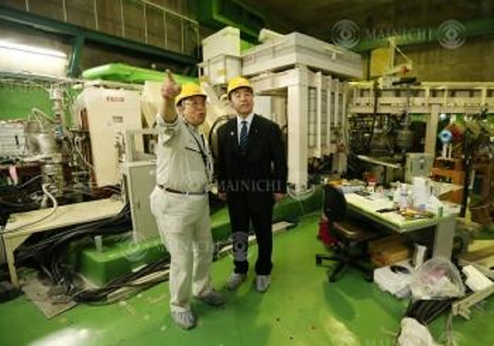 Proposed name for element 113 decided as  Nifonium Kosuke Morita of the Superheavy Elements Research Group at RIKEN Nishina Center for Accelerator Based Science explains GARIS  Gas Filled Recoil Separator  to MEXT Minister Hiroshi Hase  right . group director, at RIKEN in Wako, Saitama, Japan, June 9, 2016  Representational photo 