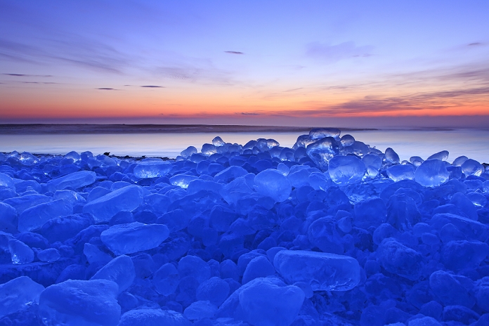 A block of ice lapping the shore at the mouth of the Tokachi River at dawn in Hokkaido.