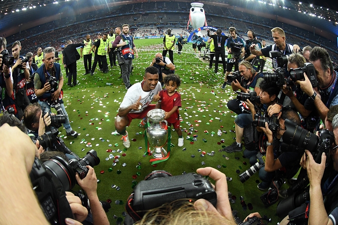 Euro 2016 Final Nani  POR , JULY 10, 2016   Football   Soccer : Nani of Portugal celebrates with his son Lucas and the trophy as he celebrates after winning the UEFA EURO 2016 Final match between Portugal 1 0 France at Stade de France in Saint Denis, France.  Photo by aicfoto AFLO 
