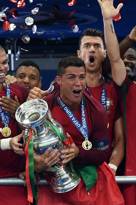 Euro 2016. Portugal wins first place  F B  Cristiano Ronaldo, Jose Fonte  POR , JULY 10, 2016   Football   Soccer : Cristiano Ronaldo of Portugal holds the trophy as he celebrates with his teammates on the podium after winning the UEFA EURO 2016 Final match between Portugal 1 0 France at Stade de France in Saint Denis, France.  Photo by aicfoto AFLO 