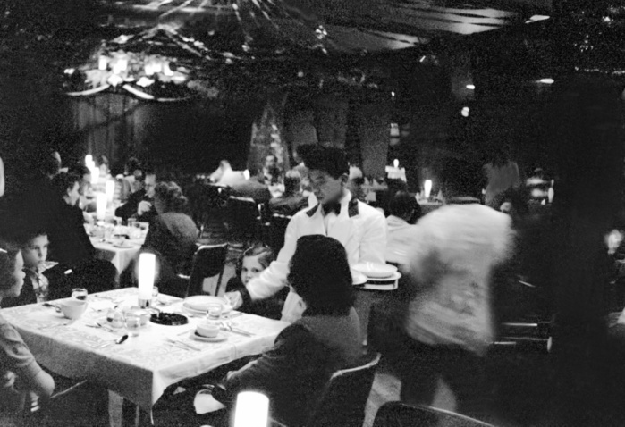 Washington Heights  December 1956  Washington Heights  housing for U.S. military officers  in Shibuya Ward, Tokyo, with a family enjoying dinner in the dining room of the club in the Heights. Washington Heights, housing for U.S. military officers, was built after the war, when the U.S. military seized land formerly used for the Yoyogi Training Camp of the former Japanese Army. The U.S. military spent 800 million yen for the construction, mobilized a total of 2.16 million people during the one year construction period, and completed about 800 units in September 1947. The site area was approximately 914,000 square meters. It is home to approximately 3,000 officers of the U.S. Army, Navy, and Air Force, and their families  including 1,200 children . Facilities within the Heights include a school, church, medical clinic, PX, theater, clubhouse, market, fire station, auto repair shop, and warehouse. Families enjoying dinner in the dining room of a club in Washington Heights, Shibuya ku, Tokyo, December 1953, photo by Jiro Futamura. Mainichi Graph, January 13, 1954, page 8, cut from page 9, Japan   Tokyo   Washington Heights, Shibuya ku, Tokyo, December 1953. Photographed by