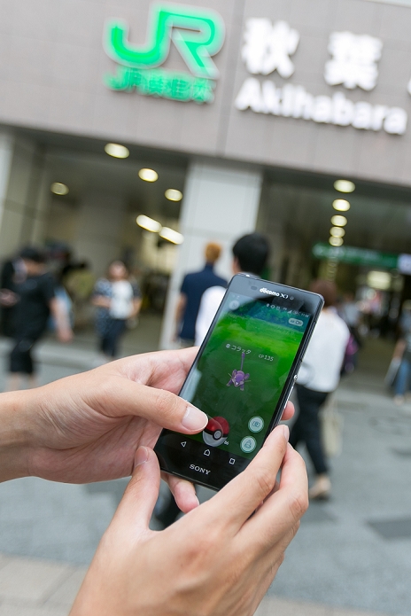 Pokemon Go  has become a social phenomenon A hot topic in Japan A man tries to catch a Pokemon character Rattata outside Akihabara Station on July 25, 2016, Tokyo, Japan. After the launch of Pokemon Go, tourist sites and summer festival organisers are reminding app users to respect manners and be aware of people around them. Meanwhile JR East train line installed posters in Shinjuku Station, one of the busiest stations in the world, to caution commuters about the dangers of using mobile devices to play games whilst walking in the station.  Photo by Rodrigo Reyes Marin AFLO 