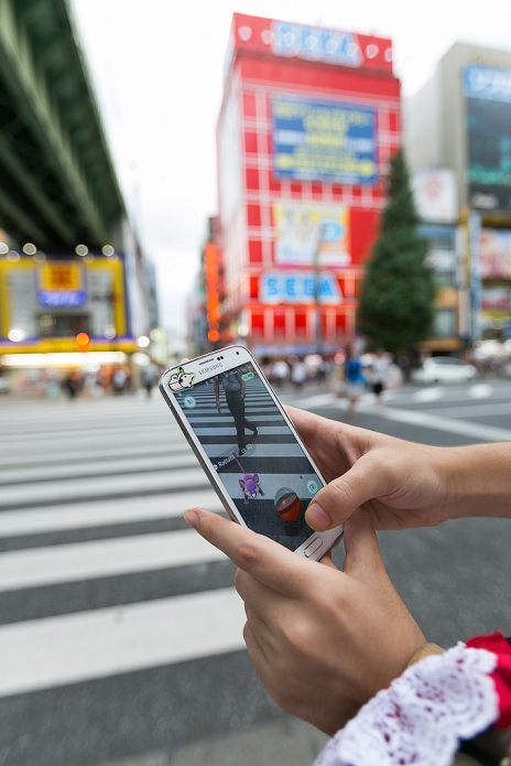 Pokemon Go  has become a social phenomenon A hot topic in Japan A woman tries to catch a Pokemon character Rattata at Akihabara electronics district on July 25, 2016, Tokyo, Japan. After the launch of Pokemon Go, tourist sites and summer festival organisers are reminding app users to respect manners and be aware of people around them. Meanwhile JR East train line installed posters in Shinjuku Station, one of the busiest stations in the world, to caution commuters about the dangers of using mobile devices to play games whilst walking in the station.  Photo by Rodrigo Reyes Marin AFLO 
