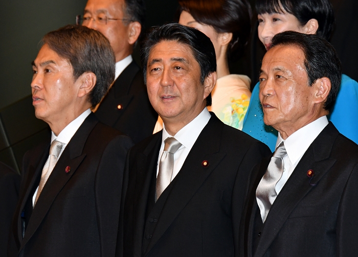 The Third Abe Reform Cabinet Commemorative photo at the Prime Minister s Office by Finance Minister Taro Aso, right, and Economic and Fiscal Policy Minister Nobuteru Ishihara, left, as they pose for photographers in an official photo call at the prime minister s office in Tokyo. Abe reshuffled his cabinet for the third time since 2012, aiming at speeding up the realization of the  Abenomics  economic policies in the wake of the land Abe reshuffled his cabinet for the third time since 2012, aiming at speeding up the realization of the  Abenomics  economic policies in the wake of the landslide victory in the July election of the Diet s upper house. Sakai AFLO  AYF  mis 