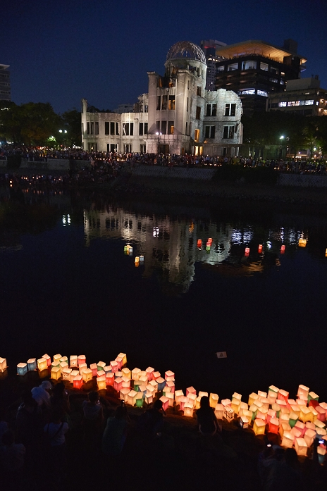 71st anniversary of the atomic bombing of Hiroshima Lantern floating ceremony to pray for peace August 6, 2016, Hiroshima, Japan : People float colorful paper lanterns into the Motoyasu River in front of the Atomic Bomb Dome marking the 71th anniversary of the atomic bombing in Hiroshima, Japan, on August 6, 2016.  Photo by AFLO 
