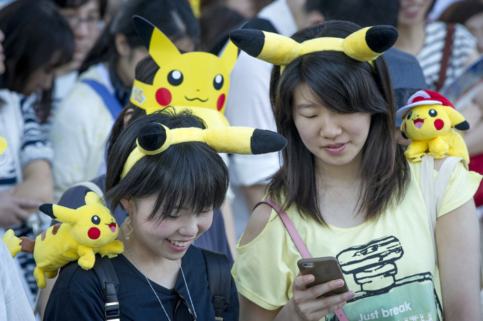 Pikachu Mass Outbreak Choo Choo  March in Minato Mirai Two cheerful Pokomen fans at the Pikachu Parade on August 7, 2016 held during the weeklong Pikachu Breakout event in the Japanese port town of Yokohama, nearby Tokyo.Photo by DUITS AFLO