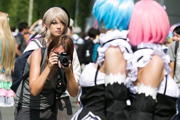 Comic Market  Kicks Off Japan s largest coterie magazine exhibition A photographer takes pictures of cosplayers during the Comic Market 90  Comiket  event in Tokyo Big Sight on August 12, 2016, Tokyo, Japan. Many manga and anime fans wearing cosplay lined up in the sun for the first day of Comiket. Comiket was established in 1975 and focuses on manga, anime, gaming and cosplay. Organizers expect more than 500,000 visitors to attend this year s summer event which runs for three days until August 14.  Photo by Rodrigo Reyes Marin AFLO 