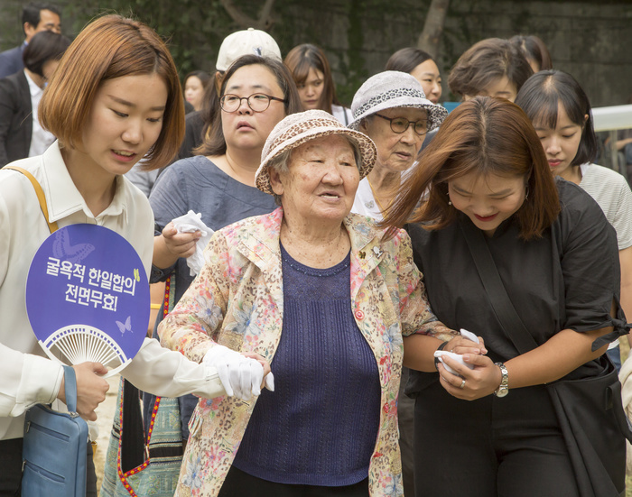 Memorial Park for Comfort Women in Seoul Place of Remembrance  Completed Kil Won ok and Kim Bok dong, Aug 29, 2016 : Kil Won ok  C, front  and Kim Bok dong  2nd R, second row , who said that they were forced to become a sex slave by Japanese army during World War II, attend an opening ceremony for a park commemorating the victims of Japan s sexual enslavement during Japan s occupation of the Korean Peninsula  1910 45 , on Mount Nam in Seoul, South Korea. The Seoul Metropolitan Government and a committee which is charge of building the memorial park held the ceremony on Monday, which  marks the 106th anniversary of the colonization. The place of the memorial park is the former residence of Japan s colonial era resident general, where the annexation treaty between Korea and Japan was signed on August 22, 1910. The treaty went into effect one week later.  Photo by Lee Jae Won AFLO   SOUTH KOREA 