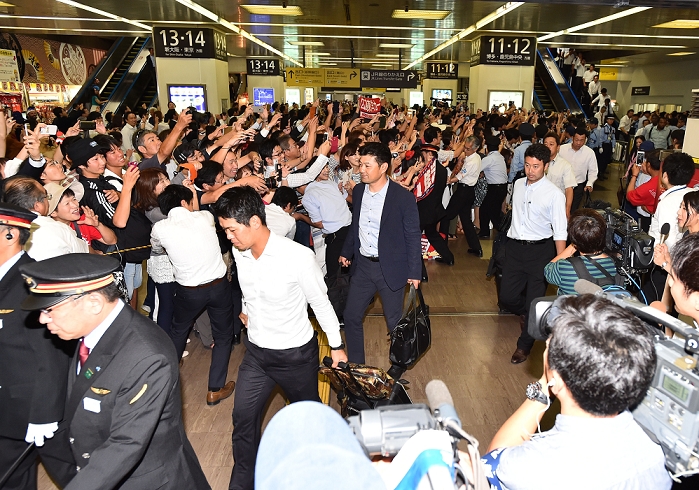 Carp Makes Triumphant Return to Hiroshima A large number of fans greeted the team Koichi Ogata  Carp , SEPTEMBER 15, 2016   Baseball : Manager Koichi Ogata  center  and the Hiroshima Nine return to Hiroshima Station, where they were greeted by a large crowd of fans, on September 15, 2016.