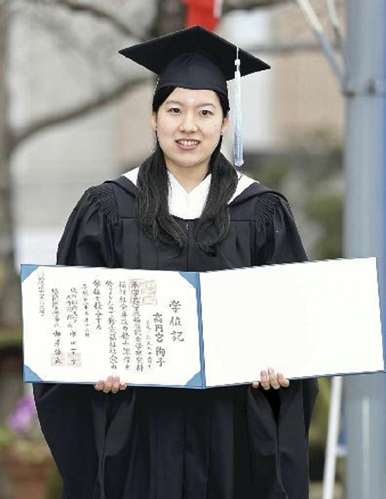 Hisako Takamado, Princess Takamado holding her Josai International University degree certificate in Togane, Chiba Prefecture Hisako Takamado holds her Josai International University degree certificate. Taken March 16, 2016, in Togane, Chiba Prefecture.