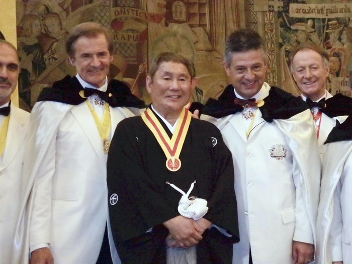 Director Takeshi Kitano (center) was awarded the title of 
