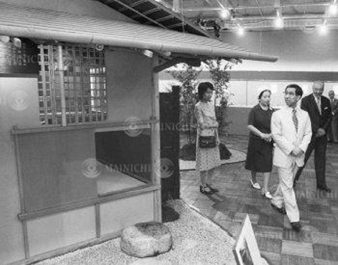 His Imperial Highness Prince Takahito of Mikasa  July 26, 1977  Mr. and Mrs. Mikasa viewing an exhibition of masterpieces of tea ceremony utensils by Rikyu, Yusai and Sansai. Mr. and Mrs. Mikasa viewing a tea room designed by Sen no Rikyu, and Ms. Yoko  far left  and Mr. Hosokawa Gosada  far right  at Takashimaya Department Store in Nihonbashi, Tokyo, Japan.