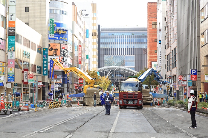 Road caves in in front of Hakata Station Caused by subway construction Recovery work continues to fill a huge sinkhole at a crossing near JR Hakata Station in Fukuoka, southwestern Japan on November 9, 2016. The hole is believed to have been caused by subway construction.  Photo by Studio Sara AFLO 