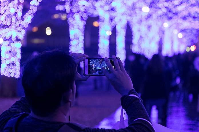 Blue Cave  Returns to Shibuya Crowded with visitors A man takes pictures to the blue LED lights during the Blue Grotto Illumination event in Shibuya on November 22, 2016, Tokyo, Japan. There are about 5,500 blue LED lights lighting up the 750 meters from Yoyogi Park to Shibuya Park Street until January 9, 2017. Tokyo s illuminations are popular date spots for couples after work during the Christmas season.  Photo by Rodrigo Reyes Marin AFLO 