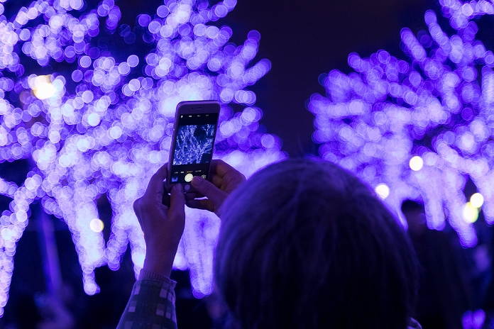 Blue Cave  Returns to Shibuya Crowded with visitors A woman takes pictures to the blue LED lights during the Blue Grotto Illumination event in Shibuya on November 22, 2016, Tokyo, Japan. There are about 5,500 blue LED lights lighting up the 750 meters from Yoyogi Park to Shibuya Park Street until January 9, 2017. Tokyo s illuminations are popular date spots for couples after work during the Christmas season.  Photo by Rodrigo Reyes Marin AFLO 