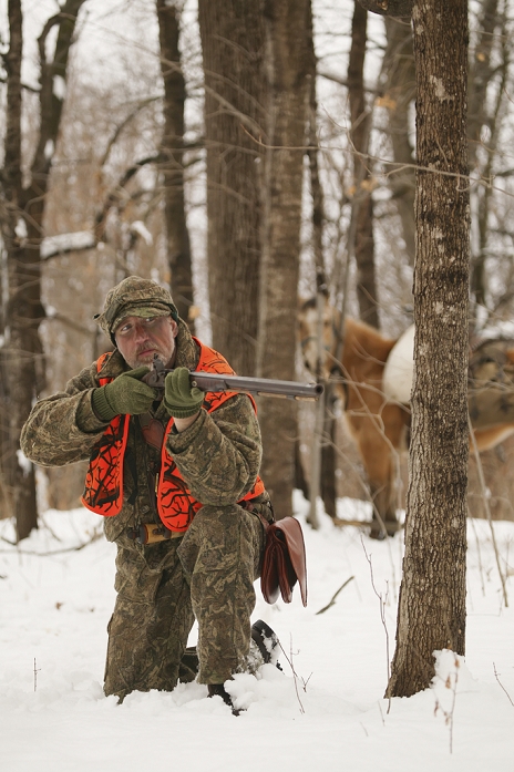 Muzzleloader Hunter With Horse Hunting In Winter