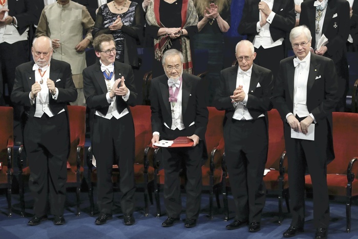 Nobel Prize 2016. Award ceremony in Stockholm  Yoshinori Osumi  center  receives applause after being awarded a medal and certificate at the Nobel Prize ceremony  afternoon of October 10 in Stockholm .