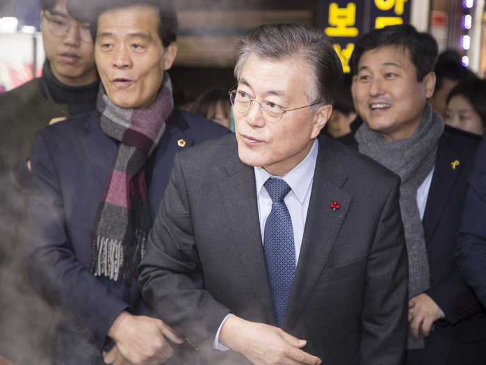 South Korea s Next Presidential Candidate Moon Jae in visits markets Moon Jae In, Jan 3, 2017 : A former head of South Korea s opposition Democratic Party Moon Jae In  front  visits a fish cakes store at a market in Seoul, South Korea. Moon is a front runner in the upcoming presidential election of South Korea. The election was originally scheduled for December this year but it could take place earlier if the Constitutional Court upholds the impeachment of President Park Geun Hye. Park was impeached on December 9, 2016 over a corruption scandal centering on her longtime confidante Choi Soon Sil.  Photo by Lee Jae Won AFLO   SOUTH KOREA 
