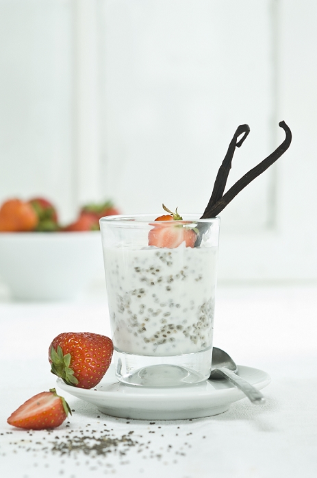 Chia pudding with fresh strawberries and vanilla bean in glass