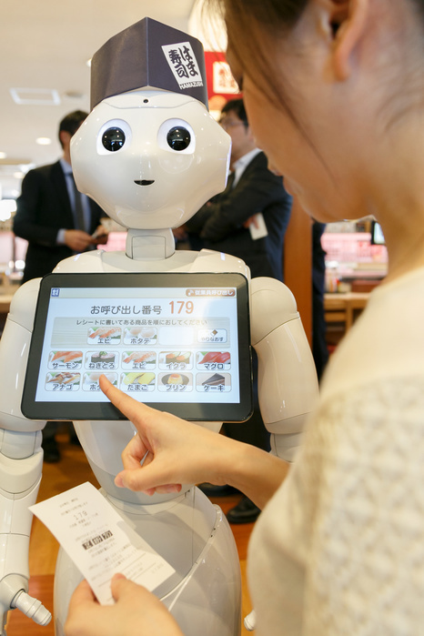 Pepper, a humanoid robot Joined Hamazushi A member of staff gives a demonstration of robot Pepper as receptionist of the Hamazushi conveyor belt sushi restaurant in Saitama, just north of Tokyo on February 2, 2017, in Japan. The humanoid robot created by SoftBank Robotics is being tested by the sushi chain to greet, take table bookings and let customers know when their seats are ready. Pepper was introduced to improve the speed of service at the already highly automated restaurant. It is hoped that in the future Pepper s facial recognition and free conversation technology will also be used to offer personalized greetings and to introduce tailor made promotions to customers.  Photo by Rodrigo Reyes Marin AFLO 