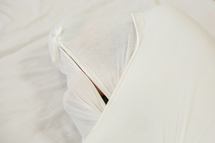 Wrapped in Cloth and Relaxed Adult Maki  has become a topic of conversation. A woman is wrapped in cloth during an Otonamaki  adult wrapping  therapy session on February 4, 2017, Tokyo, Japan. Otonamaki is a Japanese therapeutic method to reduce stiffness and posture problems. A participant, monitored by a health care professional is wrapped in a large piece of breathable cloth, like a sheet, to alleviate posture problems and body stiffness for about 15 to 20 minutes. The therapy comes from Ohinamaki, the practice of wrapping up babies in cloth in a similar way to give them a feeling of security and help them with their physical development.  Photo by Rodrigo Reyes Marin AFLO 