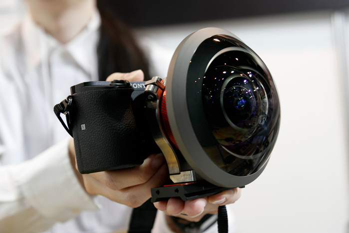 Camera trade fair  CP  . A lineup of the latest models An exhibitor shows a 250 degree lens Entaniya Fisheye for Sony cameras at the CP  Camera   Photo Imaging Show 2017 on February 23, 2017, Yokohama, Japan. CP  is the biggest camera and photo imaging trade show in Japan with 1,116 exhibitor booths and an estimated 70,000 visitors expected for the four day show. This year s exhibition is held at the Pacifico Yokohama and BankART Studio NYK and runs until Sunday 26th February.  Photo by Rodrigo Reyes Marin AFLO 