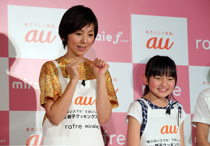  Caution Mom  Friendly Smartphones au PR event in Tokyo March 2, 2017, Tokyo, Japan   Japanese actress Marina Watanabe  L  and Rio Suzuki bake a roll cake using a cooking app of the new smart phone  rafre , produced by Kyocera in Tokyo on Thursday, March 2, 2017. The new handset features a hand gesture sensor which enablees to scroll display without touching screen.     Photo by Yoshio Tsunoda AFLO  LwX  ytd 