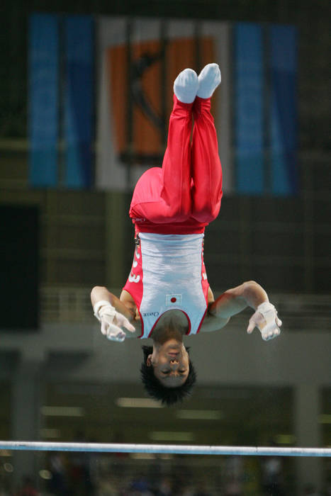 2004 Athens Olympics Gymnastics Men s uneven bars Isao Yoneda  JPN  AUGUST 23, 2004   Gymnastics Artistic : Isao Yoneda of Japan competes in the men s artistic gymnastics horizontal bar finals on August 23, 2004 during the Athens 2004 Summer Olympic Games at the Olympic Sports Complex Indoor Hall in Athens, Greece.   Photo by AFLO SPORT   1045 