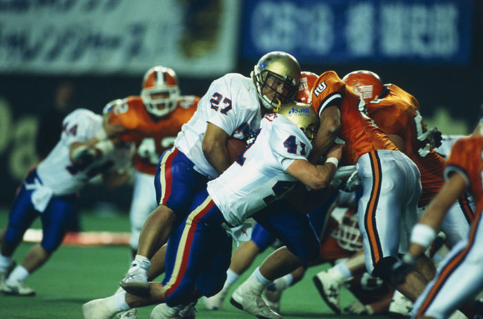 Hosei University Tomahawks vs Asahi Soft Drinks Challengers, JANUARY 4, 2001
JANUARY 4, 2001 - American Football : Hosei University Tomahawks (orange) and Asahi Soft Drinks Challengers (white) players in action during the 54th Rice Bowl match between Hosei University Tomahawks 13-52 Asahi Soft Drinks Challengers at Tokyo Dome in Tokyo, Japan.
(Photo by AFLO) [0424].