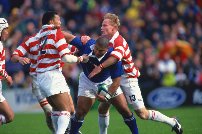 1999 Rugby World Cup First round league Pool D  L to R  Yukio Motoki, Va aiga Tuigamala  SAM , Andrew McCormick OCTOBER 3, 1999   Rugby : Va aiga Tuigamala of Samoa is challenged by Yukio Motoki  12 and Andrew McCormick  13 of Japan during the IRB World Cup 1999 Pool D match between Japan 9 43 Samoa at Racecourse Ground in Wrexham, Wales.   Photo by Jun Tsukida AFLO SPORT   0003 .