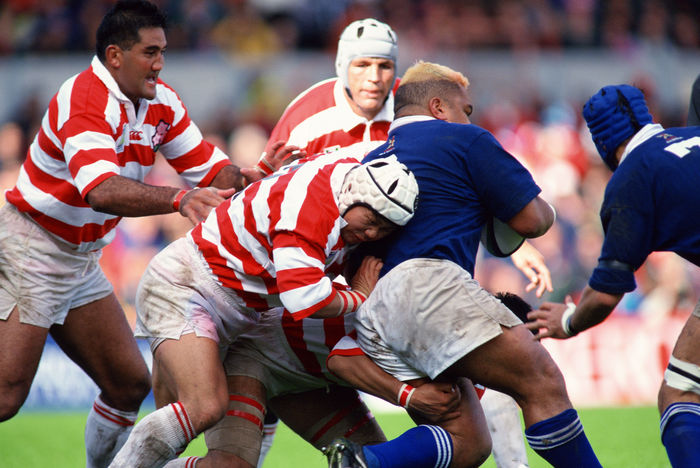1999 Rugby World Cup First round league Pool D Masahiro Kunda, Jamie Joseph  JPN  OCTOBER 3, 1999   Rugby : Masahiro Kunda  C  and Jamie Joseph  L  of Japan fight for the ball against Trevor Leota of Samoa during the IRB World Cup 1999 Pool D match between Japan 9 43 Samoa at Racecourse Ground in Wrexham, Wales.   Photo by Jun Tsukida AFLO SPORT   0003 .