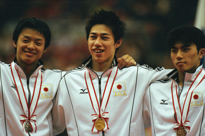 Yoshihiro Saito (JPN), Akihiro Kasamatsu (JPN), Naoya Tsukahara (JPN)
NOVEMBER 11, 2000 - Artistic Gymnastics : Yoshihiro Saito (C, gold), Akihiro Kasamatsu (L, silver) and Naoya Tsukahara (R, bronze) celebrate on the podium after winning their medals in the Men's All-around at the 2000 Chunichi Cup competition in Nagoya, Japan.
 (Photo by Jun Tsukida/AFLO SPORT) [0003].