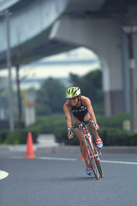 Machiko Nakanishi (JPN)
JULY 18, 1999 - Triathlon : Machiko Nakanishi of Japan bikes during the 1999 Sprint Triathlon National Championships at Rainbow Town in Tokyo, Japan.
 (Photo by Jun Tsukida/AFLO SPORT) [0003].