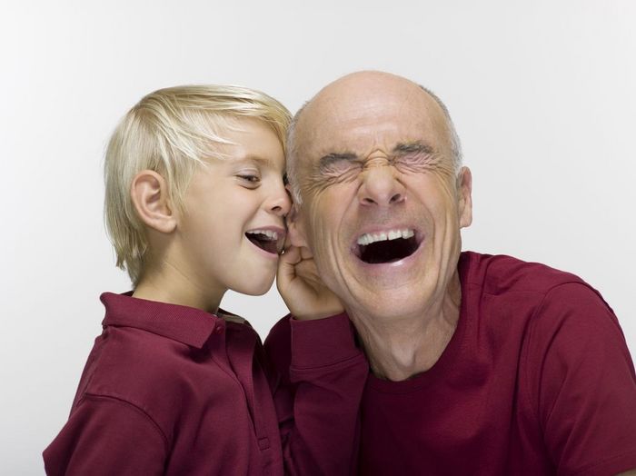 WESTF06467 Grandson and grandfather, laughing, portrait, close up