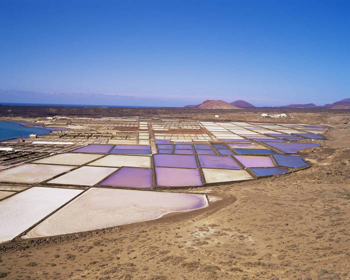 Salt pans and volcanoes in the background, near Yaiza, Lanzarote, Canary Islands, Spain, Atlantic, Europe