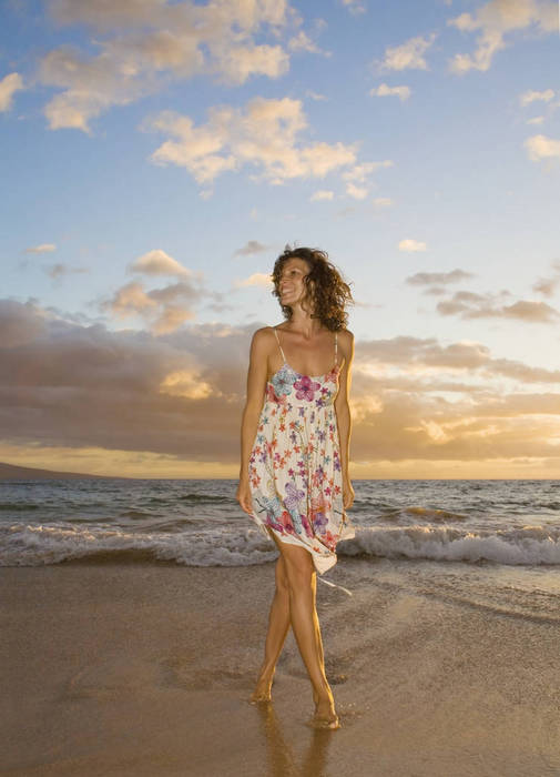 Hawaii, Maui, Woman standing on the shore of remote tropical location.