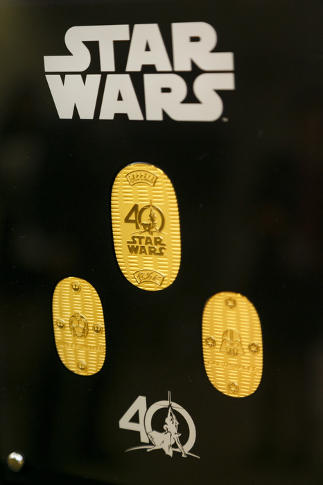 Million dollar gold Darth Vader mask goes on sale in Tokyo Commemorative 24k gold coins of the film series Star Wars on display at the Ginza Tanaka jewelry store on April 25, 2017, Tokyo, Japan. To the celebrate the 40th anniversary of the series of Star Wars, the Japanese jewelry store is selling a life size mask of Darth Vader made from 15kg of pure 24k gold. The Mask is valued at approximately 1.4 million US Dollars. The store is also selling sets of 24k gold commemorative coins with prices ranging from USD 1,201 to 11,124. The products will go on sale on Star Wars Day, May 4th.  Photo by Rodrigo Reyes Marin AFLO 