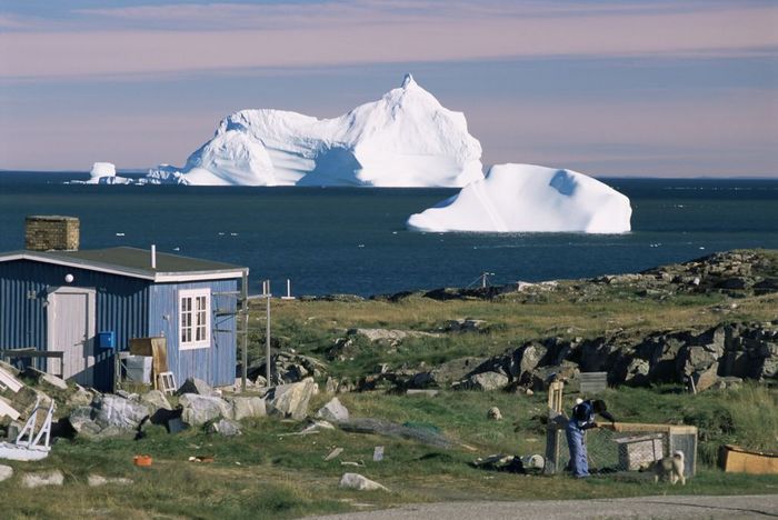 World Heritage: Ilulissat Icefjord
 Painted wooden fisherman's house in front of icebergs in Disko Bay, Qeqertarsuaq (Godhavn), Disko Island, west coast, Greenland, Polar Regions