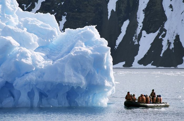 Zodiac from ice breaker tour ship, Krossfjorden icebergs, Spitsbergen, Svalbard, Arctic, Norway, Scandinavia, Europe