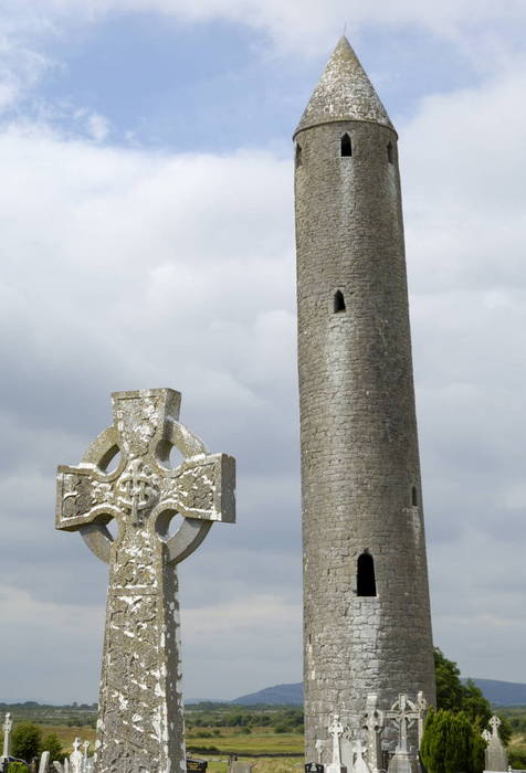   Kilmacdaugh Round Tower and Celtic style cross, near Gort, County Galway, Connacht, Republic of Ireland, Europe