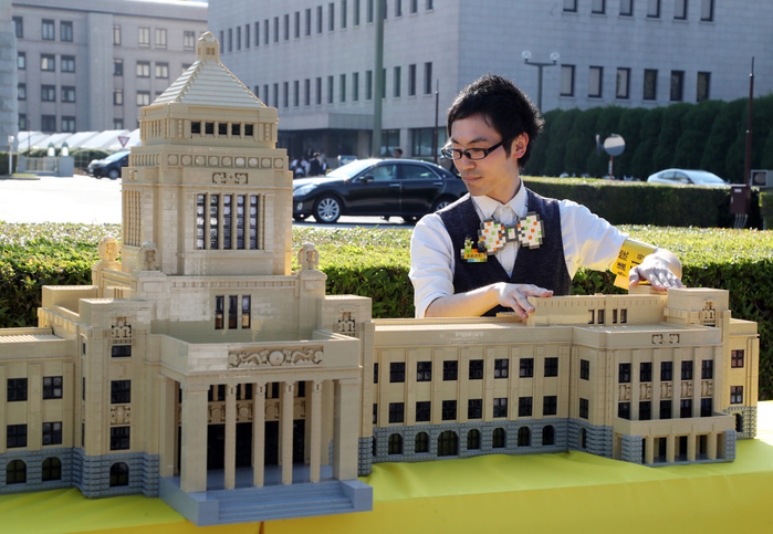The Parliament Building made of LEGO appeared in front of the Parliament. May 19, 2017, Tokyo, Japan   Japanese Lego master builder Yoshihiro Osawa puts final pieces on the Lego blocks made Diet building before the real Diet building in Tokyo on Friday, May 19, 2017 to celebrate the 70th anniversary of Japan s Upper House. The 1 70 scale model Japan s Diet building, 3m wideth and 80cm tall with some 30,000 Lego blocks will be opened for public May 20 and 21.    Photo by Yoshio Tsunoda AFLO  LwX  ytd 