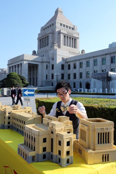 Parliament Building Made of Legos Appears in Front of Parliament May 19, 2017, Tokyo, Japan   Japanese Lego master builder Yoshihiro Osawa puts final pieces on the Lego blocks made Diet building before the real Diet building in Tokyo on Friday, May 19, 2017 to celebrate the 70th anniversary of Japan s Upper House. The 1 70 scale model Japan s Diet building, 3m wideth and 80cm tall with some 30,000 Lego blocks will be opened for public May 20 and 21.    Photo by Yoshio Tsunoda AFLO  LwX  ytd 